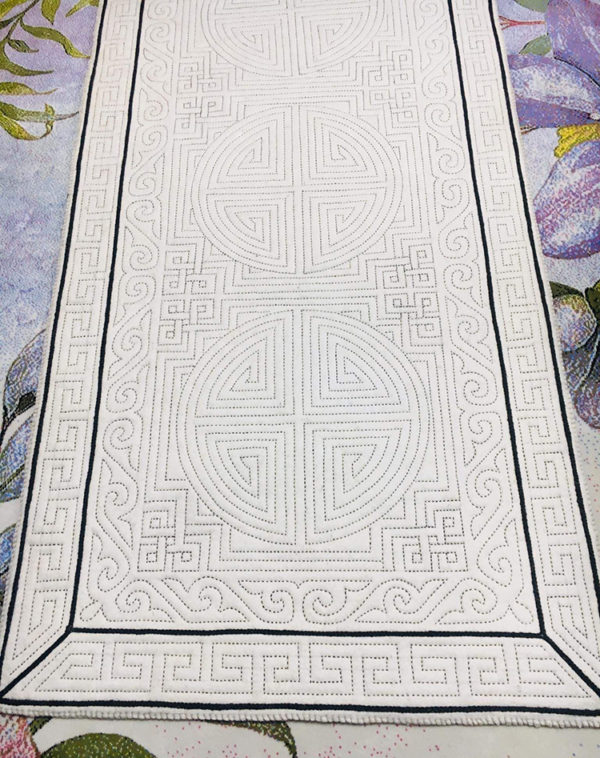 An embroidered round felt rug 1